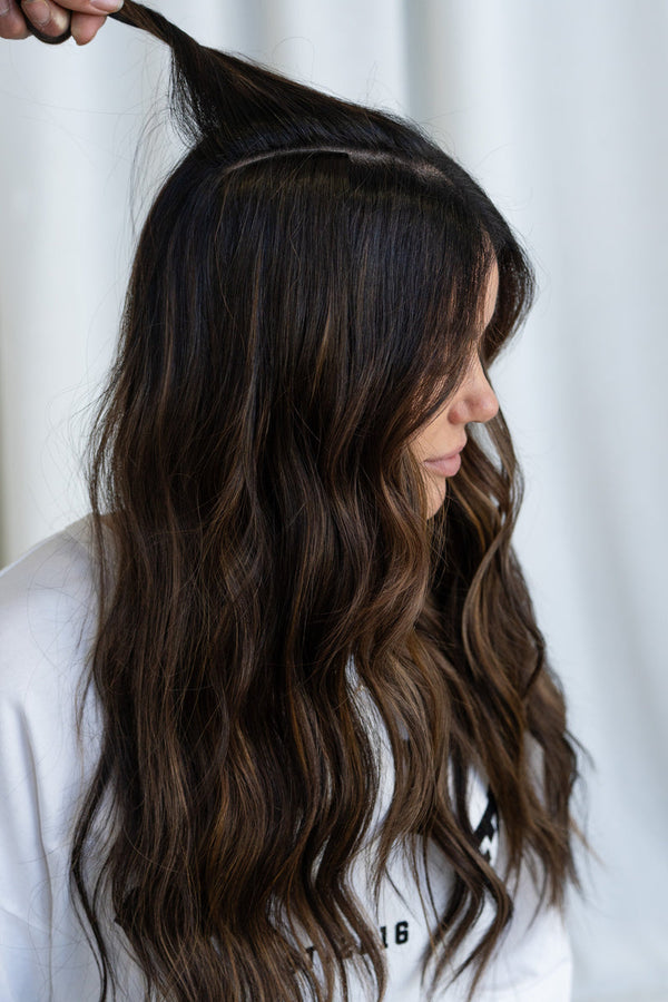 Brunette model with a section of her hair lifted