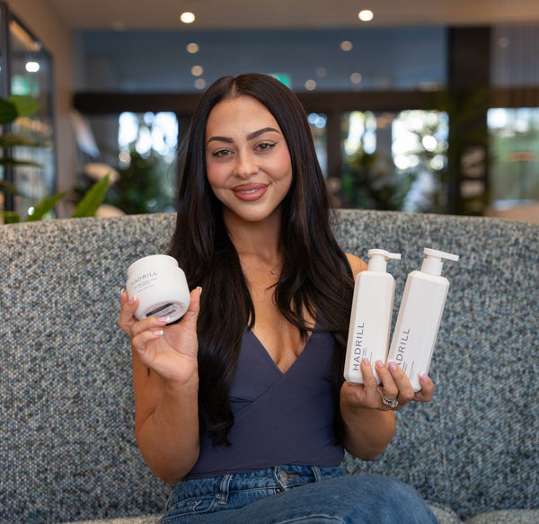 Emilee Hembrow holding Hadrill The Shampoo, The Conditioner and The Treatment Mask